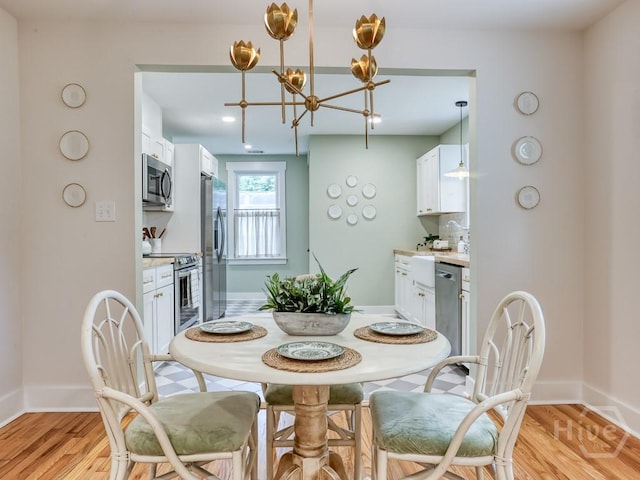 2409 E 37th St, Savannah, GA 31404 - dining space featuring a chandelier and light wood finished floors