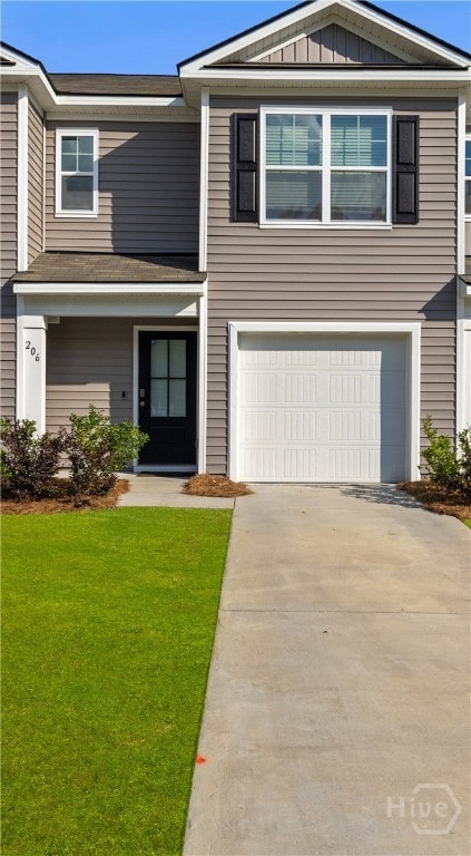 206 Coneflower Rd, Bloomingdale, GA 31302 - view of front of house with driveway, a garage, a front yard, and board and batten siding
