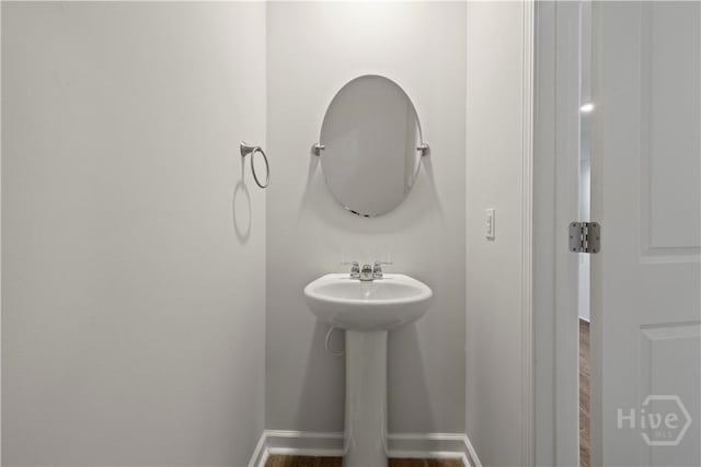 206 Coneflower Rd, Bloomingdale, GA 31302 - bathroom with baseboards and wood finished floors