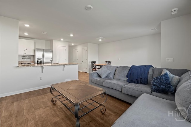 206 Coneflower Rd, Bloomingdale, GA 31302 - living room with wood finished floors and recessed lighting