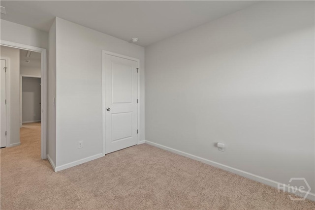 206 Coneflower Rd, Bloomingdale, GA 31302 - unfurnished bedroom with light colored carpet and attic access