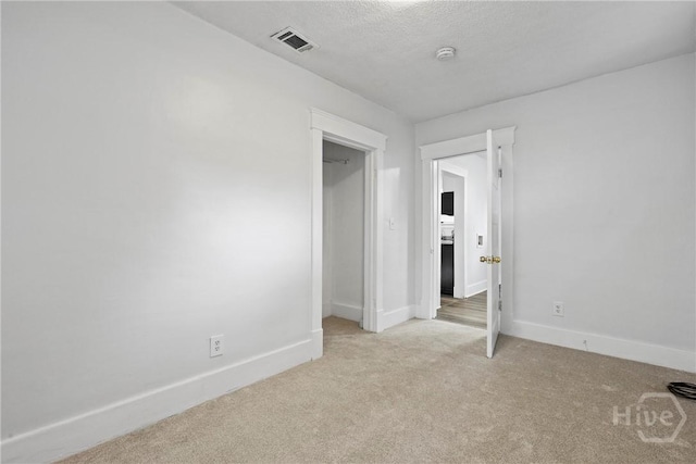 1122 SE 36th St, Savannah, GA 31404 - unfurnished bedroom featuring light carpet and a textured ceiling