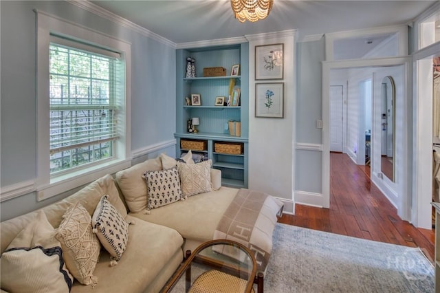 531 E 31st St, Savannah, GA 31401 - living area with hardwood / wood-style flooring, ornamental molding, and built in shelves