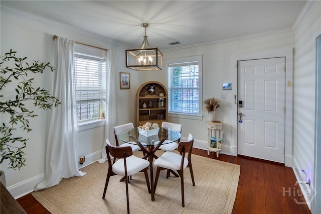 531 E 31st St, Savannah, GA 31401 - dining space with a chandelier, crown molding, and wood-type flooring