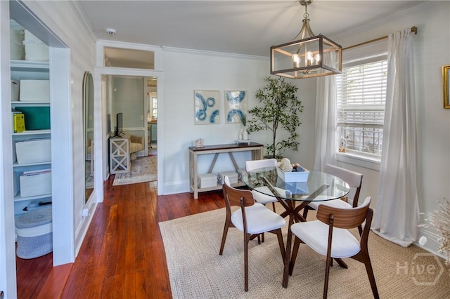 531 E 31st St, Savannah, GA 31401 - dining area featuring crown molding, a chandelier, and wood finished floors