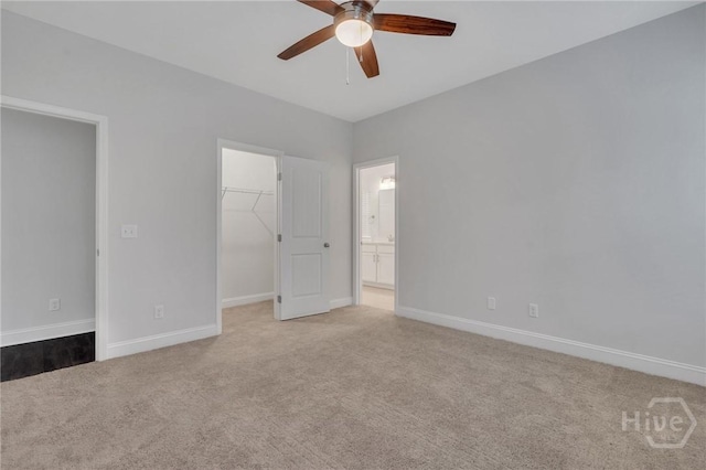 102 Simon Cir, Guyton, GA 31312 - unfurnished bedroom with carpet floors, a walk in closet, a closet, a ceiling fan, and ensuite bathroom