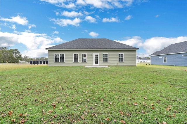 102 Simon Cir, Guyton, GA 31312 - back of property with a yard and a patio