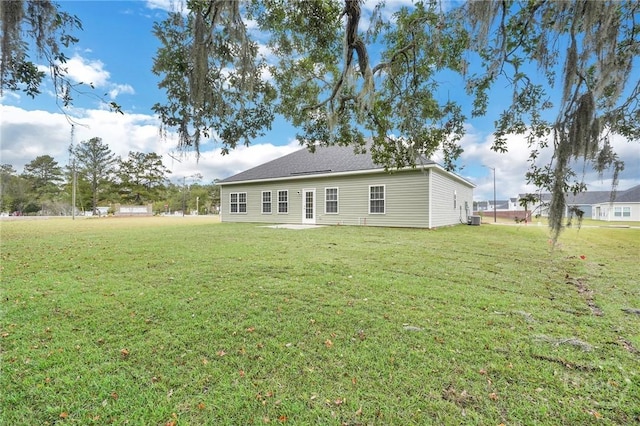 102 Simon Cir, Guyton, GA 31312 - back of property featuring a yard