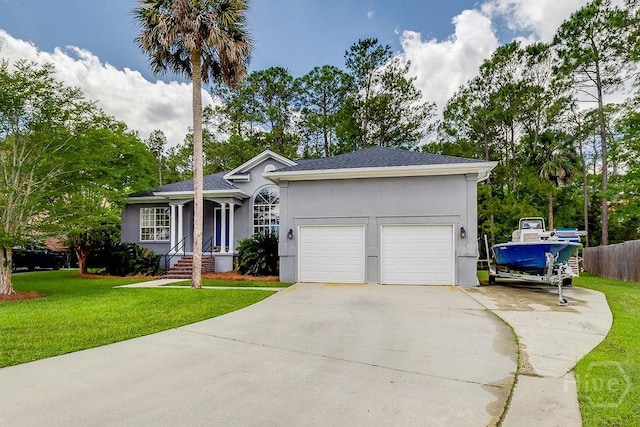 7 Settlers Pt, Savannah, GA 31406 - ranch-style home featuring concrete driveway, a garage, a front lawn, and stucco siding