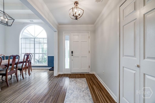 7 Settlers Pt, Savannah, GA 31406 - entrance foyer with a chandelier, dark wood finished floors, and crown molding