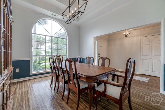 7 Settlers Pt, Savannah, GA 31406 - dining space with crown molding, a chandelier, and dark wood-style flooring