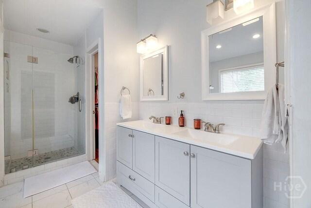 7 Settlers Pt, Savannah, GA 31406 - bathroom featuring a shower stall, double vanity, a spacious closet, and recessed lighting