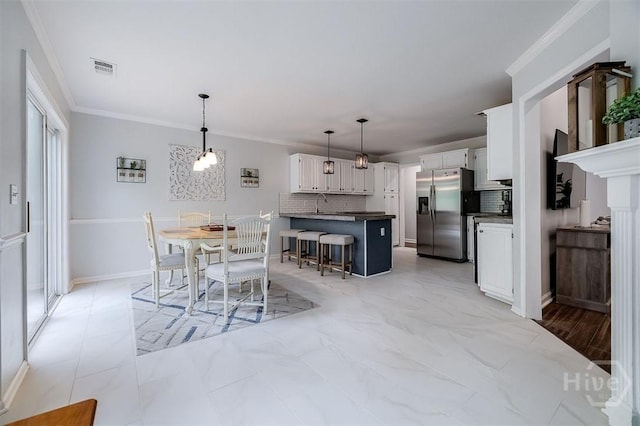 7 Settlers Pt, Savannah, GA 31406 - dining room featuring crown molding and baseboards