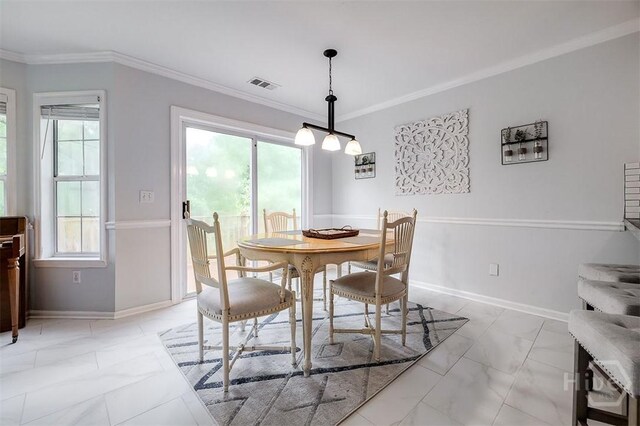 7 Settlers Pt, Savannah, GA 31406 - dining room featuring light marble finish floors, plenty of natural light, and ornamental molding