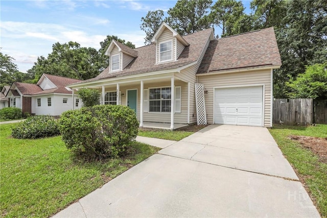 217 Bordeaux Ln, Savannah, GA 31419 - cape cod house with a garage, a porch, a shingled roof, and concrete driveway