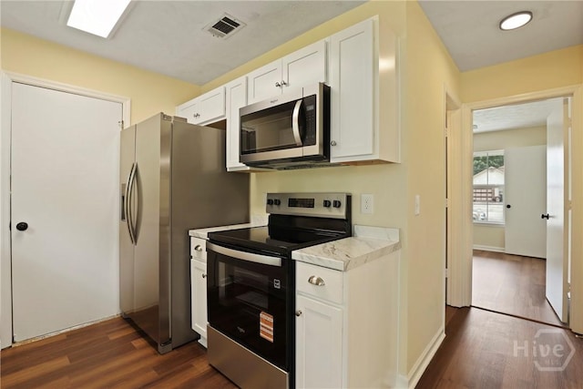 217 Bordeaux Ln, Savannah, GA 31419 - kitchen featuring stainless steel appliances, dark wood-type flooring, light countertops, and white cabinetry