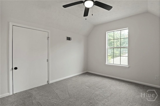 217 Bordeaux Ln, Savannah, GA 31419 - additional living space with lofted ceiling, carpet floors, a textured ceiling, and a ceiling fan