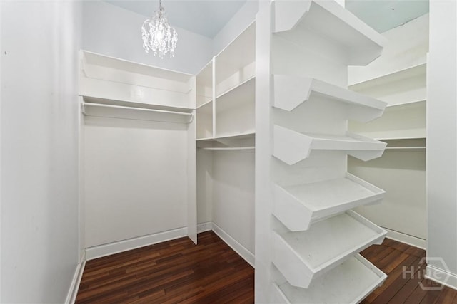 45 Shore Rd, Savannah, GA 31419 - walk in closet featuring wood finished floors and a chandelier