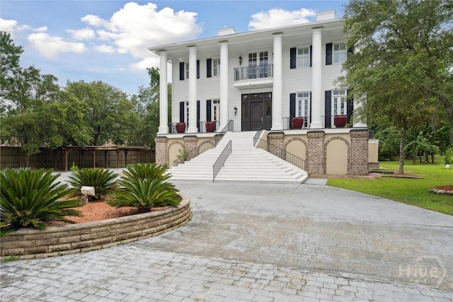 45 Shore Rd, Savannah, GA 31419 - greek revival house featuring stairway, a balcony, and covered porch