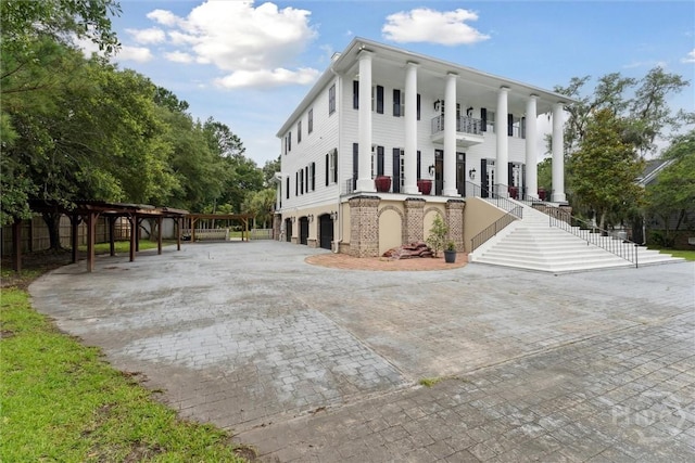 45 Shore Rd, Savannah, GA 31419 - view of building exterior featuring a garage and decorative driveway