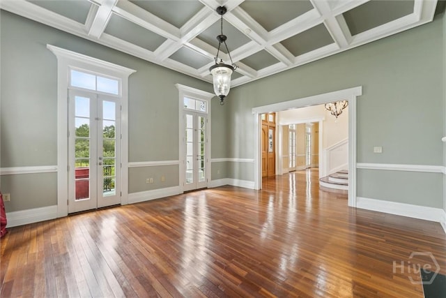 45 Shore Rd, Savannah, GA 31419 - empty room with french doors, wood-type flooring, stairs, coffered ceiling, and beamed ceiling