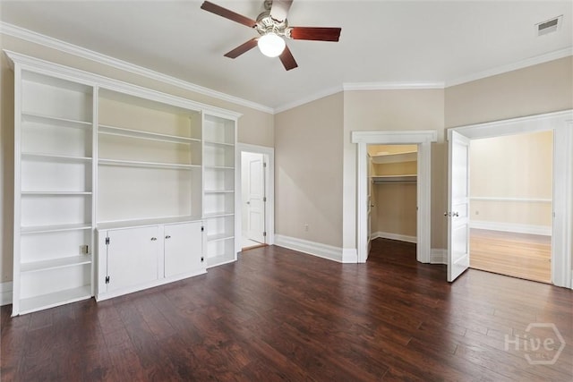 45 Shore Rd, Savannah, GA 31419 - unfurnished bedroom featuring dark wood-style flooring, ornamental molding, ceiling fan, and a spacious closet
