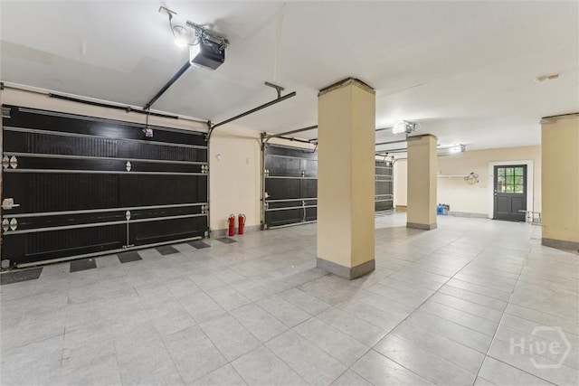 45 Shore Rd, Savannah, GA 31419 - garage featuring a garage door opener and baseboards
