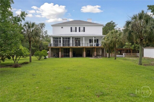 45 Shore Rd, Savannah, GA 31419 - back of house with a yard, a chimney, and a sunroom