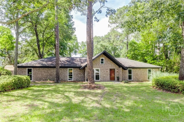 7012 Sandnettles Dr, Savannah, GA 31410 - view of front of property featuring brick siding and a front lawn