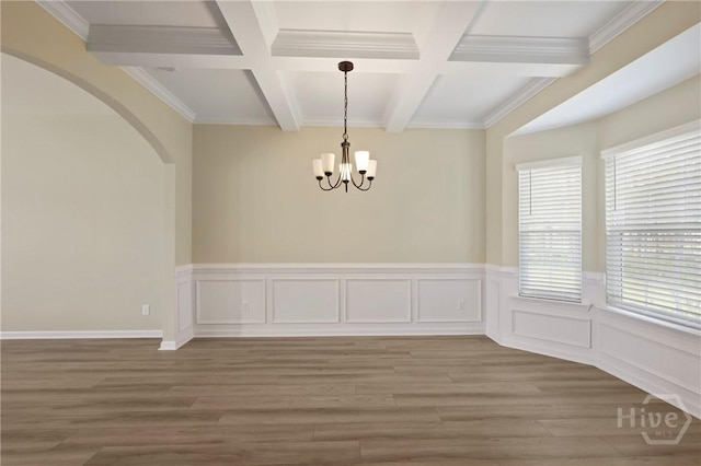 1447 Arnold Dr SE, Allenhurst, GA 31301 - unfurnished dining area featuring beam ceiling, wood finished floors, coffered ceiling, arched walkways, and a chandelier