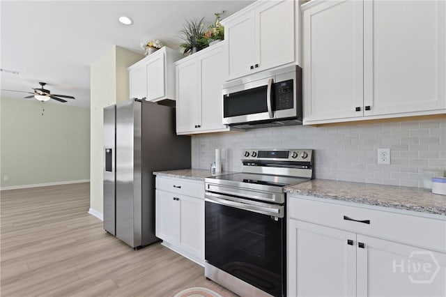 1447 Arnold Dr SE, Allenhurst, GA 31301 - kitchen featuring appliances with stainless steel finishes, a ceiling fan, light wood-style floors, white cabinetry, and recessed lighting