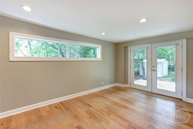416 E 61st St, Savannah, GA 31405 - unfurnished room featuring healthy amount of natural light, french doors, light wood-style floors, and recessed lighting