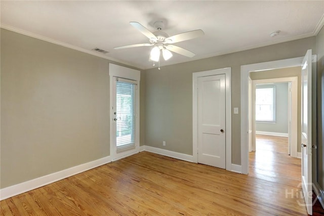 416 E 61st St, Savannah, GA 31405 - empty room with light wood-style flooring, crown molding, a ceiling fan, and a smoke detector