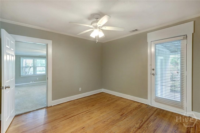 416 E 61st St, Savannah, GA 31405 - spare room featuring ornamental molding, light wood-type flooring, and a ceiling fan