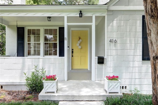 416 E 61st St, Savannah, GA 31405 - property entrance featuring concrete block siding and covered porch