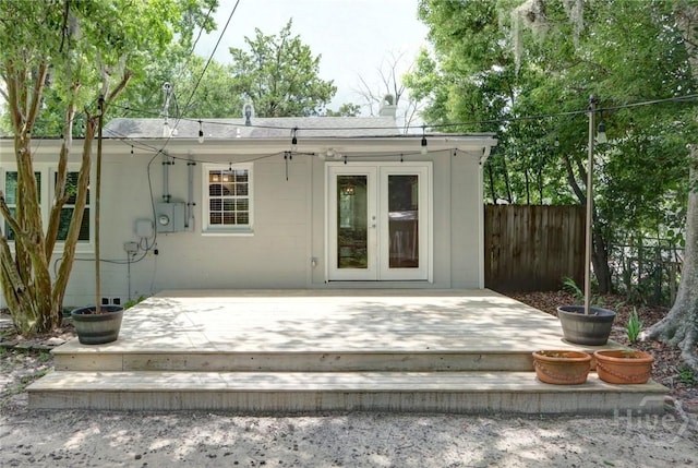 416 E 61st St, Savannah, GA 31405 - back of property with french doors, a wooden deck, and a chimney