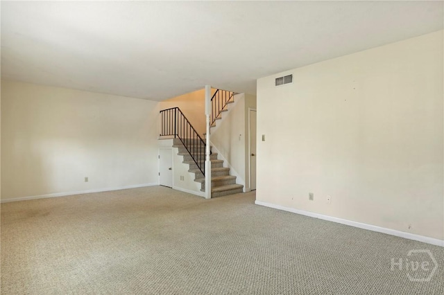 455 Mall Blvd Unit 39, Savannah, GA 31406 - unfurnished living room with light carpet and stairs