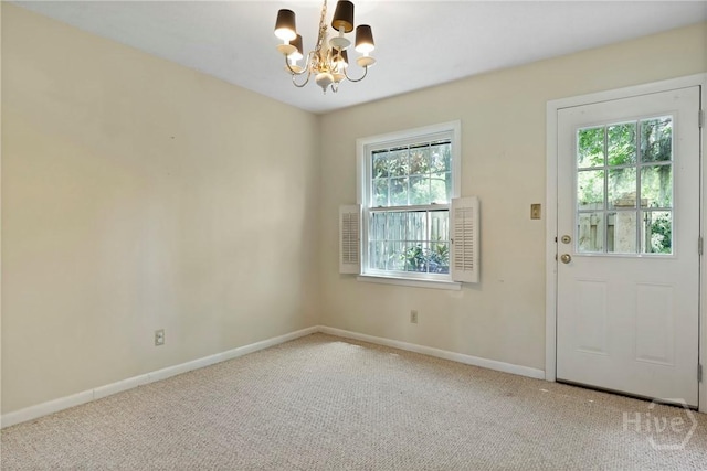 455 Mall Blvd Unit 39, Savannah, GA 31406 - carpeted entrance foyer featuring a chandelier and healthy amount of natural light