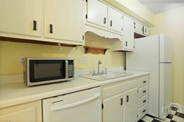455 Mall Blvd Unit 39, Savannah, GA 31406 - kitchen with white appliances, light countertops, white cabinetry, and tile patterned floors