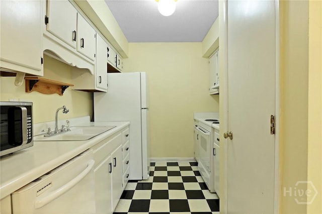 455 Mall Blvd Unit 39, Savannah, GA 31406 - kitchen with white appliances, dark floors, light countertops, and white cabinetry