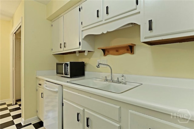 455 Mall Blvd Unit 39, Savannah, GA 31406 - kitchen with stainless steel microwave, dishwasher, tile patterned floors, light countertops, and white cabinets