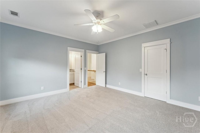 15 Sabal Dr, Richmond Hill, GA 31324 - unfurnished bedroom featuring light colored carpet, crown molding, connected bathroom, and a ceiling fan