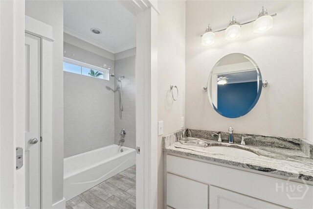 15 Sabal Dr, Richmond Hill, GA 31324 - full bathroom featuring vanity, shower / washtub combination, crown molding, and wood finished floors