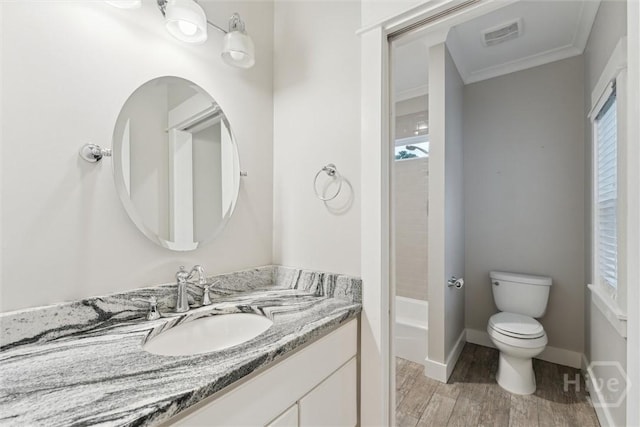 15 Sabal Dr, Richmond Hill, GA 31324 - bathroom with vanity, wood finished floors, ornamental molding, and bathtub / shower combination
