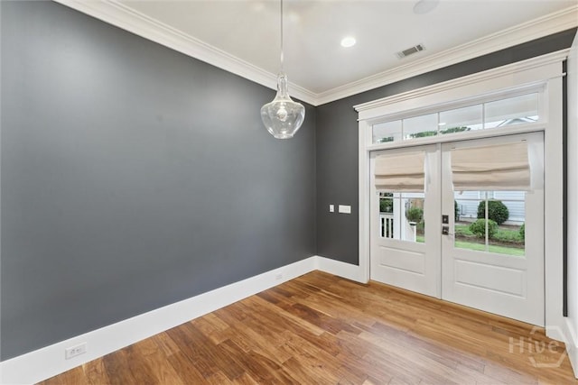 15 Sabal Dr, Richmond Hill, GA 31324 - spare room with wood finished floors, crown molding, french doors, and recessed lighting