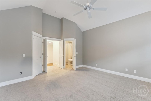 15 Sabal Dr, Richmond Hill, GA 31324 - unfurnished bedroom featuring light carpet, connected bathroom, ceiling fan, and high vaulted ceiling