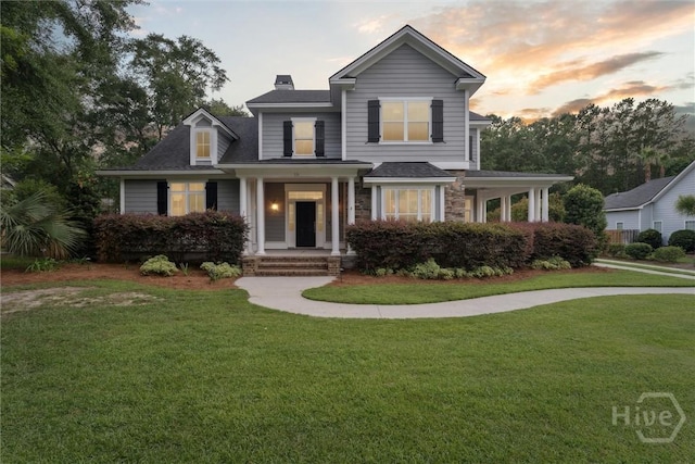 15 Sabal Dr, Richmond Hill, GA 31324 - traditional-style home with a lawn, a chimney, and stone siding
