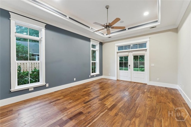 15 Sabal Dr, Richmond Hill, GA 31324 - unfurnished room featuring a tray ceiling, a ceiling fan, hardwood / wood-style floors, french doors, and ornamental molding