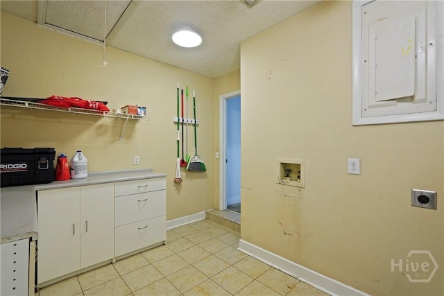 75 Brown Thrasher Ct, Richmond Hill, GA 31324 - laundry room featuring electric dryer hookup, hookup for a washing machine, electric panel, light tile patterned floors, and cabinet space