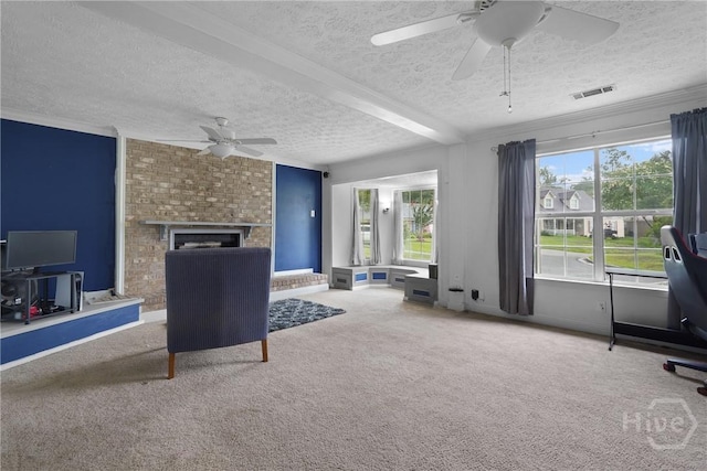 75 Brown Thrasher Ct, Richmond Hill, GA 31324 - living room with ceiling fan, a textured ceiling, healthy amount of natural light, carpet floors, and a fireplace